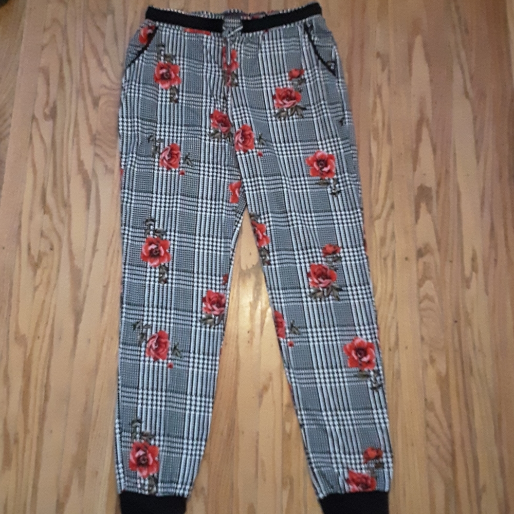 Black and white joggers with red flower